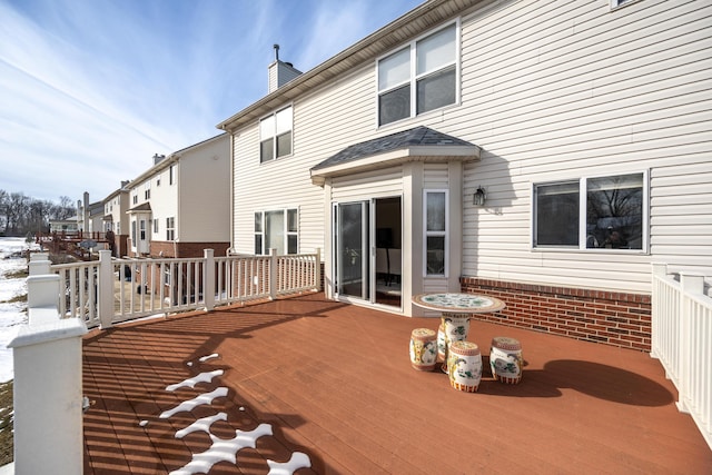 view of snow covered deck