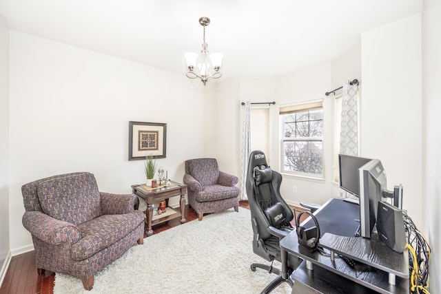 office featuring wood-type flooring and a chandelier