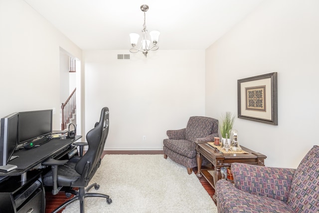 office with an inviting chandelier and wood-type flooring