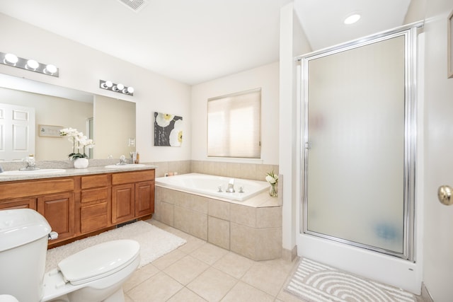 full bathroom featuring vanity, toilet, separate shower and tub, and tile patterned flooring