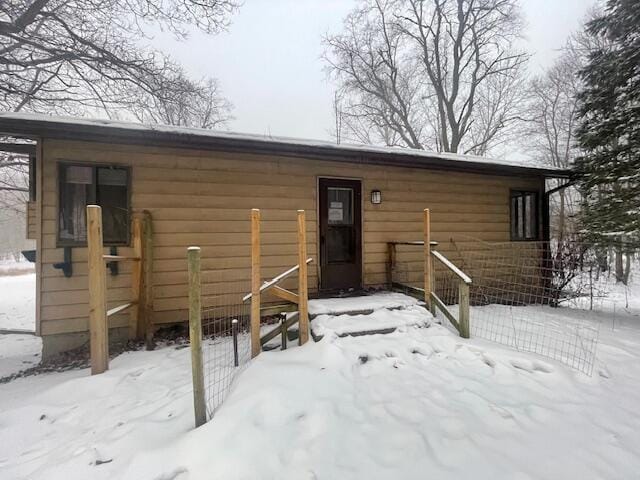 view of snow covered house