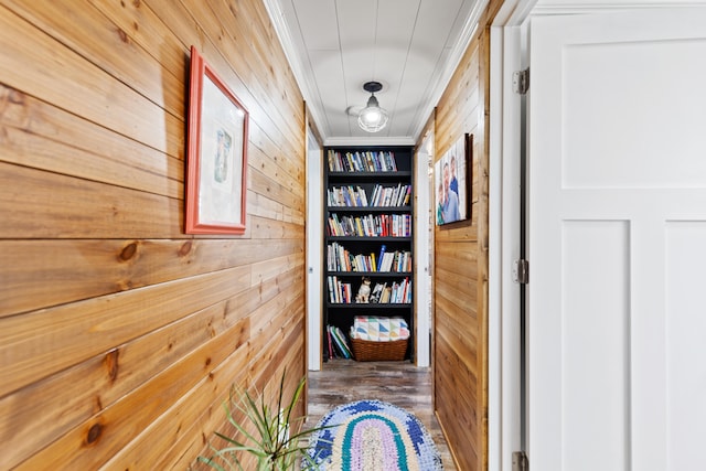 3509 N Shore Dr, Sears, MI 49679 - hallway with wood walls, wood finished floors, built in shelves, and ornamental molding