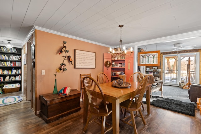 3509 N Shore Dr, Sears, MI 49679 - dining area featuring ornamental molding, dark wood finished floors, ceiling fan with notable chandelier, and built in shelves
