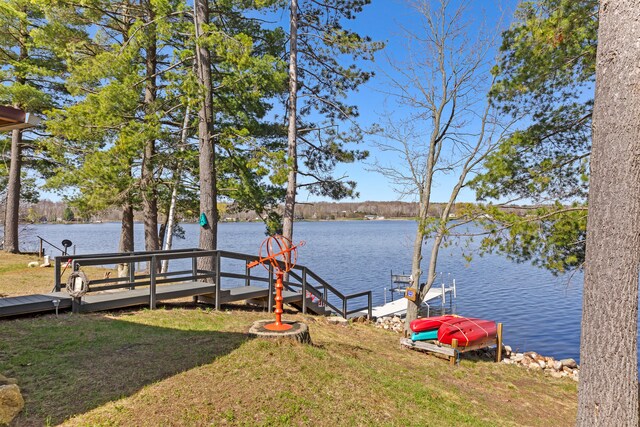 3509 N Shore Dr, Sears, MI 49679 - exterior space featuring a boat dock