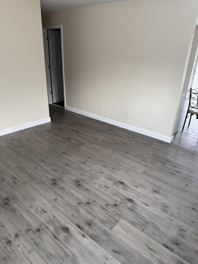 spare room with hardwood / wood-style floors