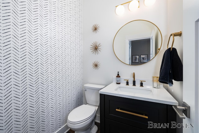 bathroom featuring vanity and toilet