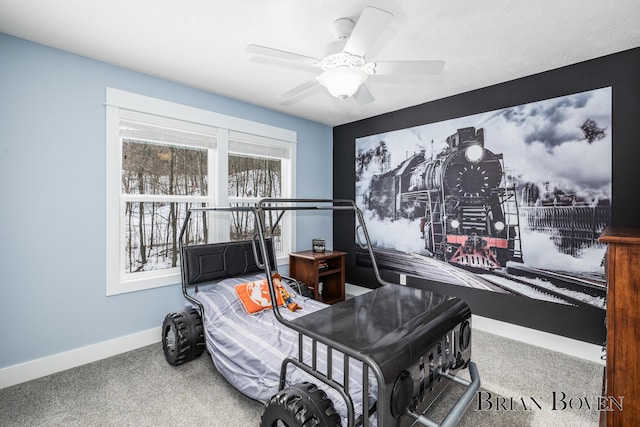 interior space with ceiling fan