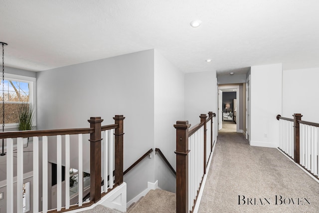 corridor with light colored carpet