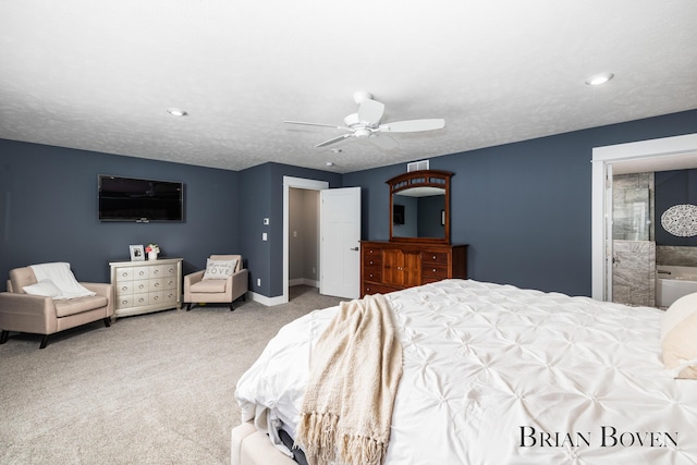 carpeted bedroom with ceiling fan and a textured ceiling