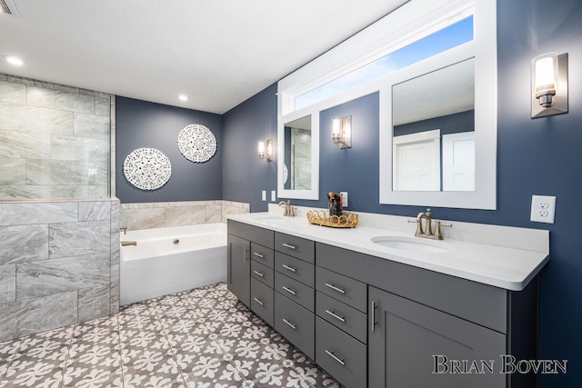 bathroom with vanity and a bathtub