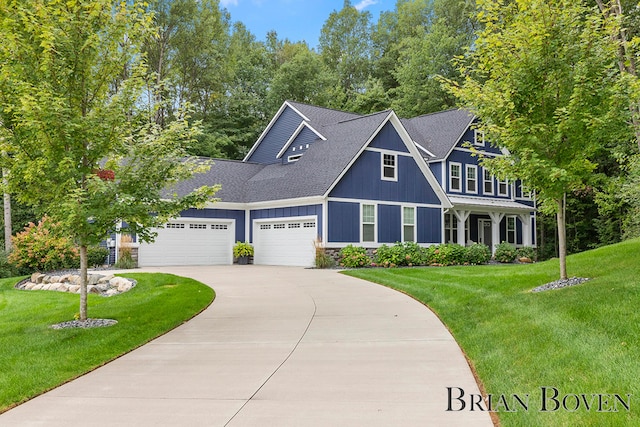 view of front facade featuring a garage and a front yard