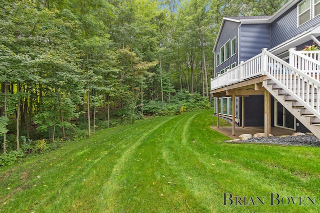 view of yard with a wooden deck