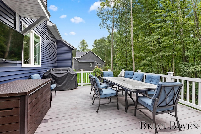 wooden terrace featuring grilling area