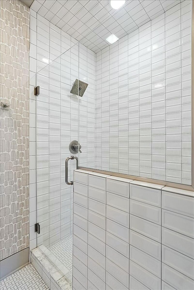 bathroom featuring a shower with shower door