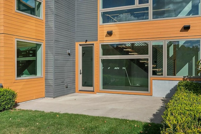 doorway to property featuring a patio