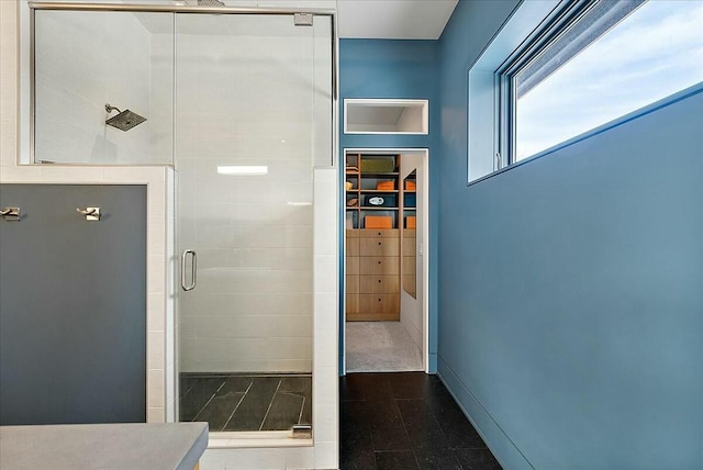 bathroom featuring a tile shower