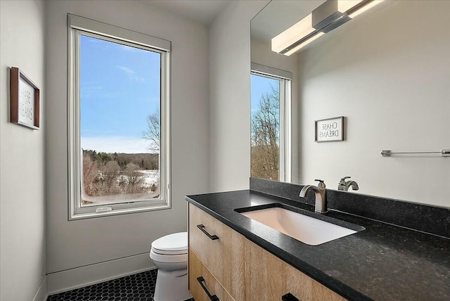 bathroom with vanity and toilet