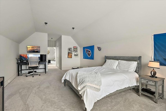 bedroom with lofted ceiling and carpet flooring