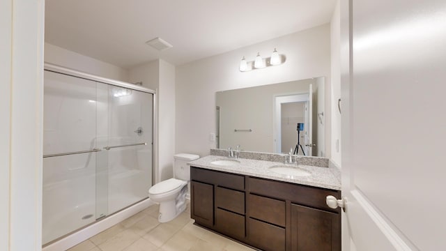 bathroom with vanity, an enclosed shower, tile patterned floors, and toilet