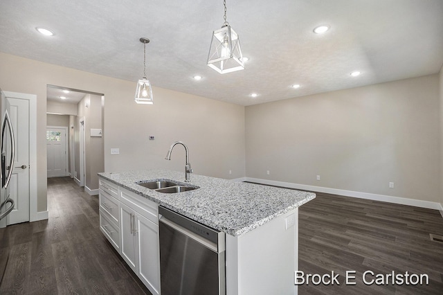 kitchen with sink, an island with sink, white cabinets, decorative light fixtures, and stainless steel dishwasher