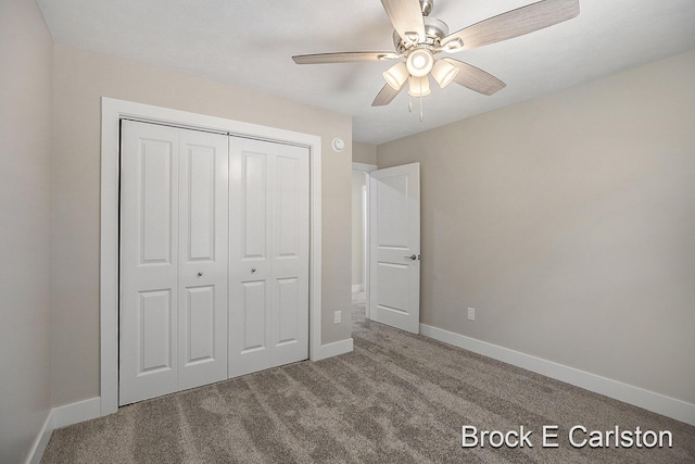 unfurnished bedroom featuring carpet flooring, ceiling fan, and a closet