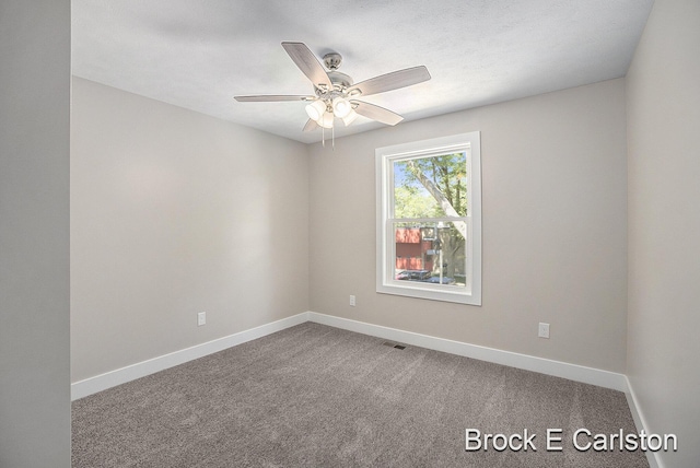 unfurnished room with carpet floors and ceiling fan