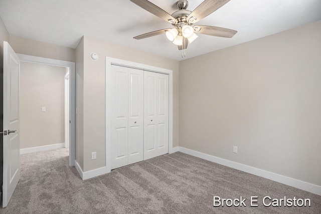 unfurnished bedroom featuring a closet, ceiling fan, and carpet