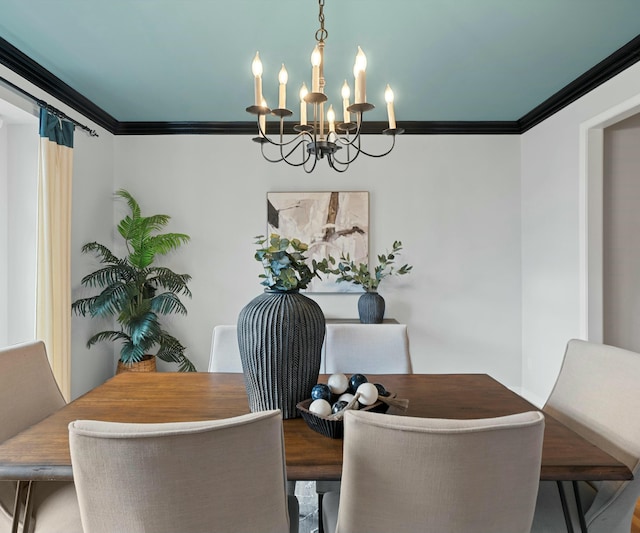 dining space featuring ornamental molding and a notable chandelier