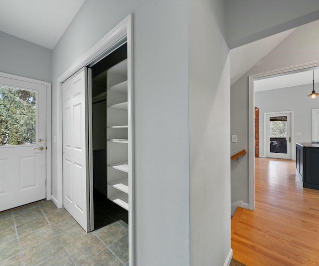 hallway with wood-type flooring