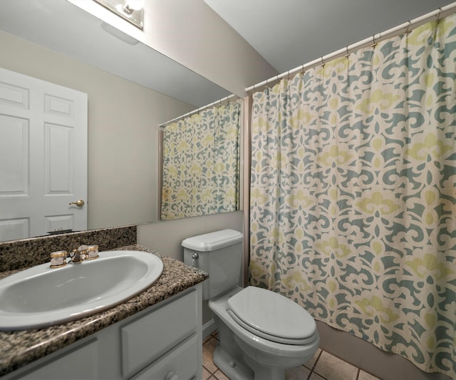 bathroom featuring tile patterned floors, toilet, and vanity