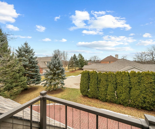 view of yard with a balcony