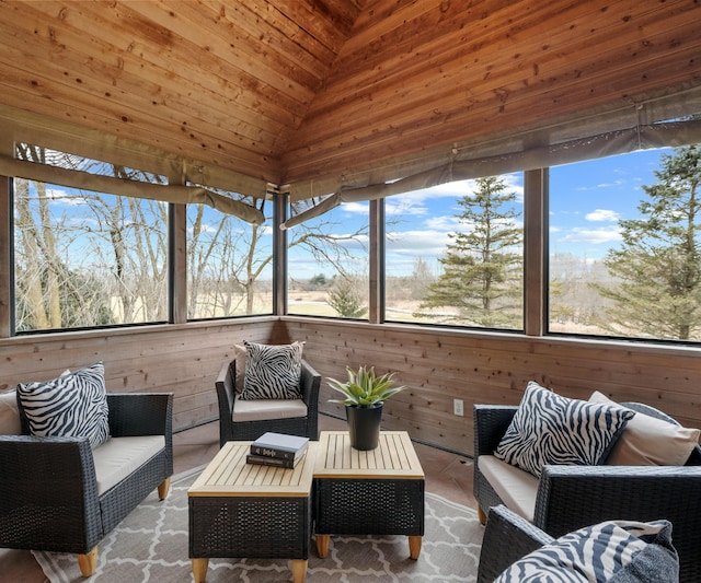 sunroom featuring vaulted ceiling