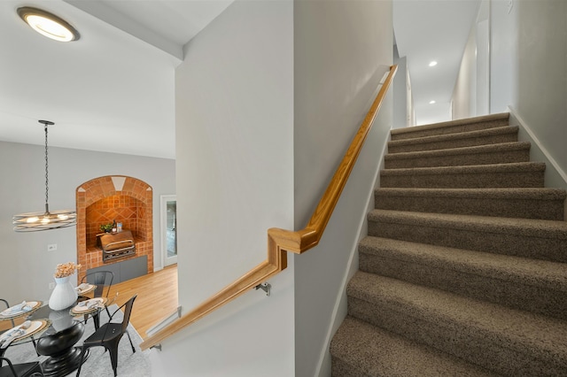 staircase with wood-type flooring