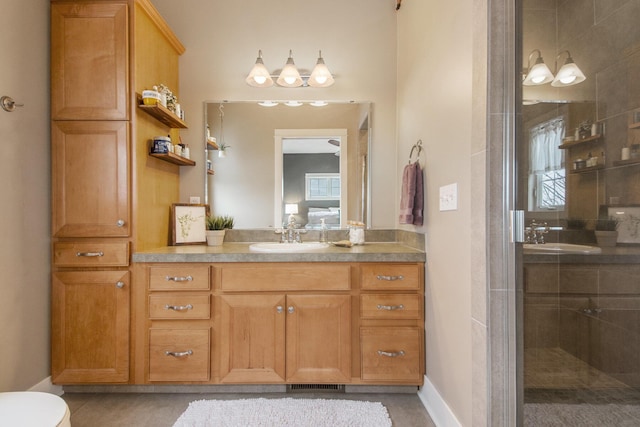 bathroom with vanity, tile patterned floors, and walk in shower