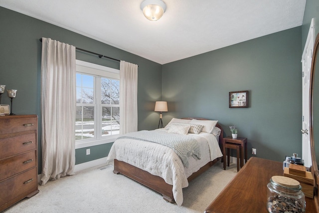 bedroom with light colored carpet