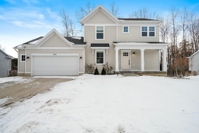 view of front facade with a garage and covered porch