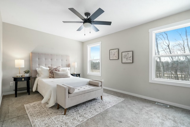 bedroom with ceiling fan and carpet flooring