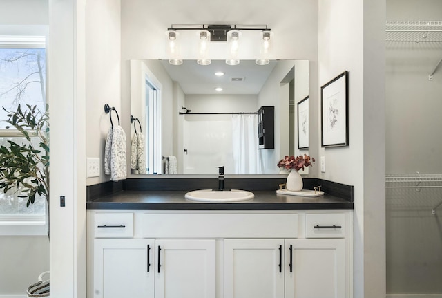 bathroom with vanity and a shower with curtain