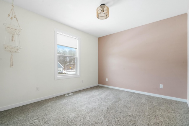 unfurnished room featuring carpet flooring