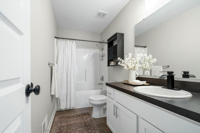 full bathroom with vanity, toilet, hardwood / wood-style floors, and shower / bath combo with shower curtain