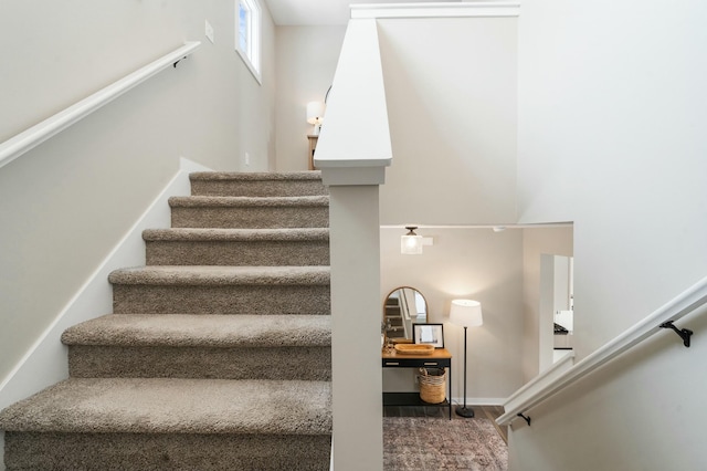 stairway featuring wood-type flooring