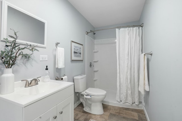 bathroom with vanity, toilet, and a shower with shower curtain