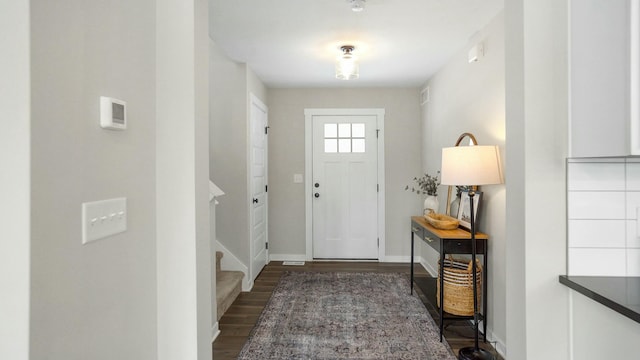 foyer entrance with dark hardwood / wood-style flooring