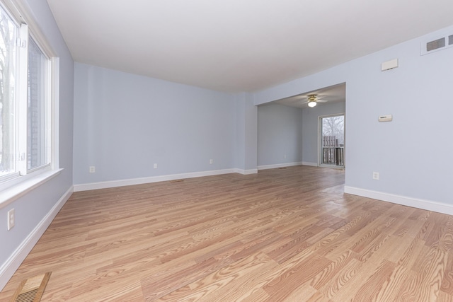 spare room featuring ceiling fan and light hardwood / wood-style floors