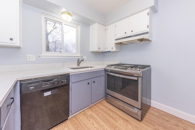 kitchen featuring stainless steel range with gas cooktop, black dishwasher, sink, white cabinets, and light wood-type flooring