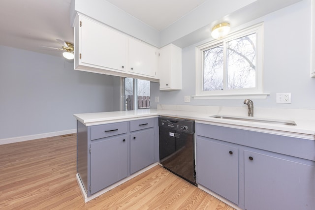 kitchen with white cabinetry, dishwasher, sink, light hardwood / wood-style floors, and kitchen peninsula