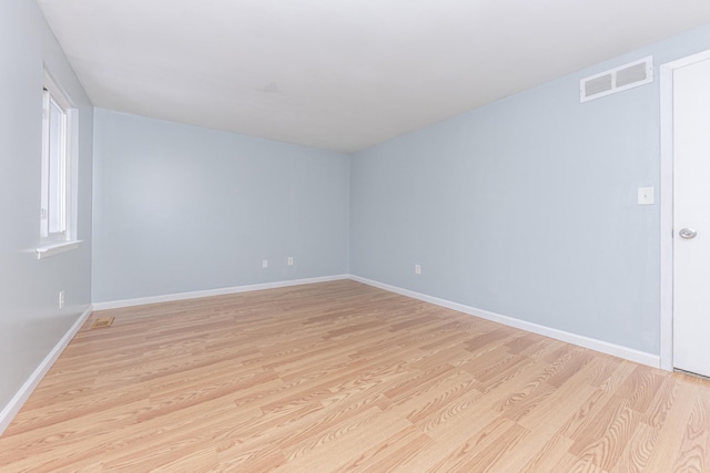 unfurnished room with light hardwood / wood-style flooring