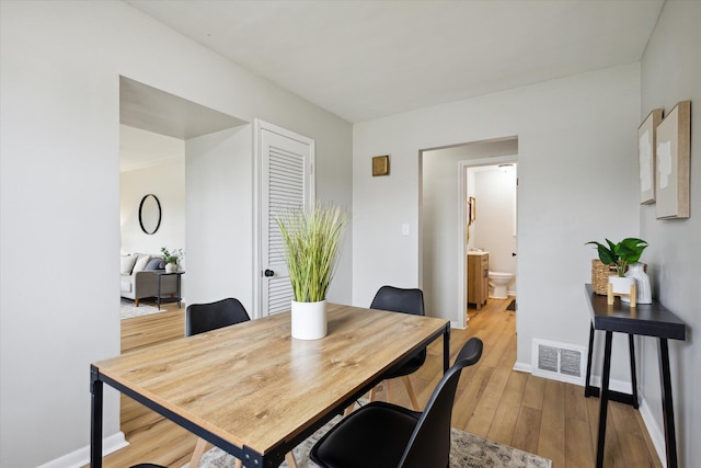 dining room featuring light hardwood / wood-style floors