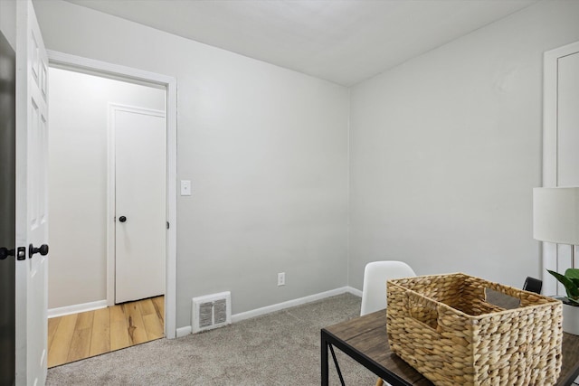 sitting room featuring carpet floors