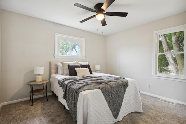 bedroom featuring ceiling fan and carpet